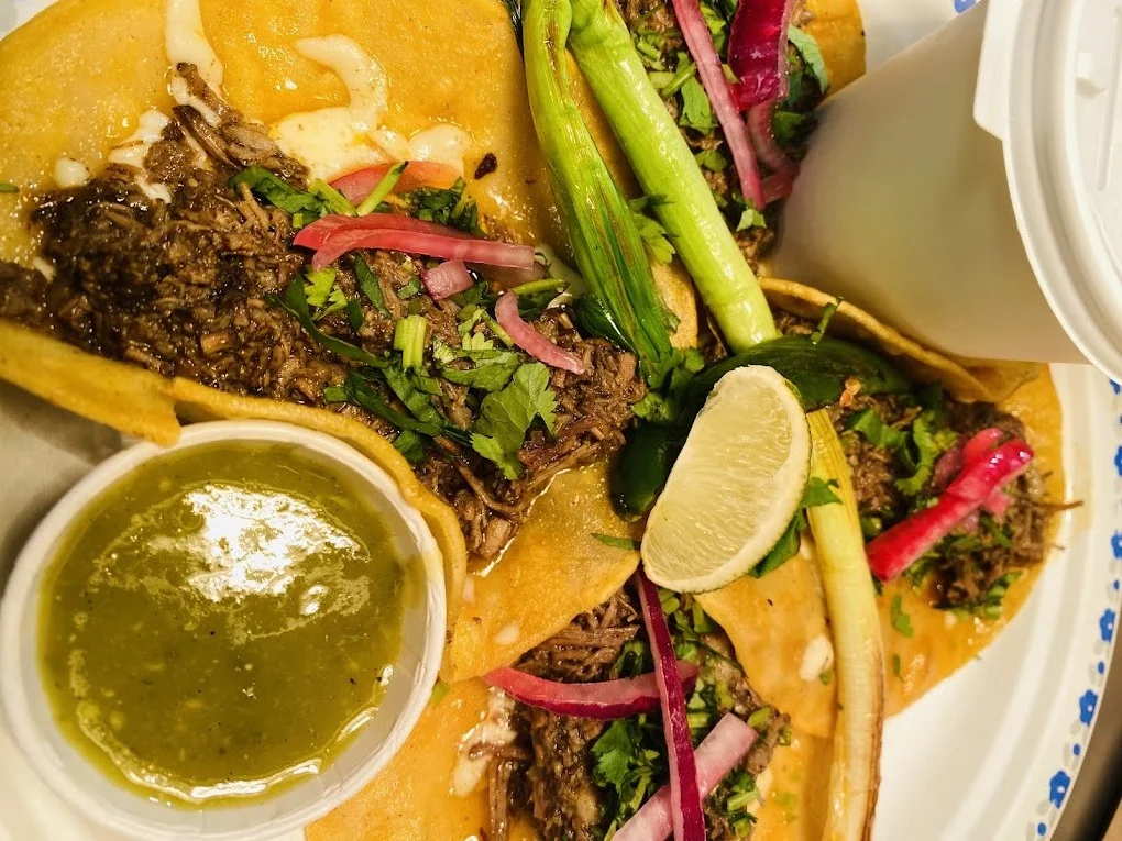 Homemade chilaquiles and nachos at authentic Mexican taqueria in Edmonton
