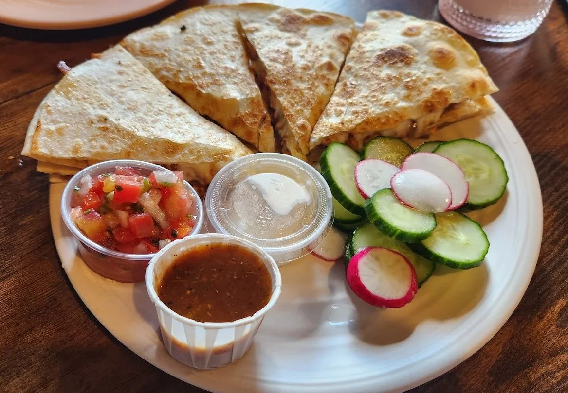 Quesadillas at Taqueria El Chingon Edmonton - Melted cheese between golden flour tortillas with fresh toppings